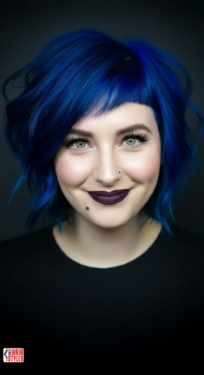 10. Bold Blue Wolf Cut with Short Bangs | 10 Daring Medium-Length Wolf Cut Ideas For An Edgy Look