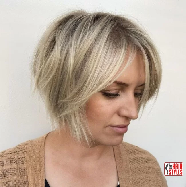 Asymmetrical Bob with Feathered Bangs | 30 Low-Maintenance Medium-Length Hairstyles With Bangs