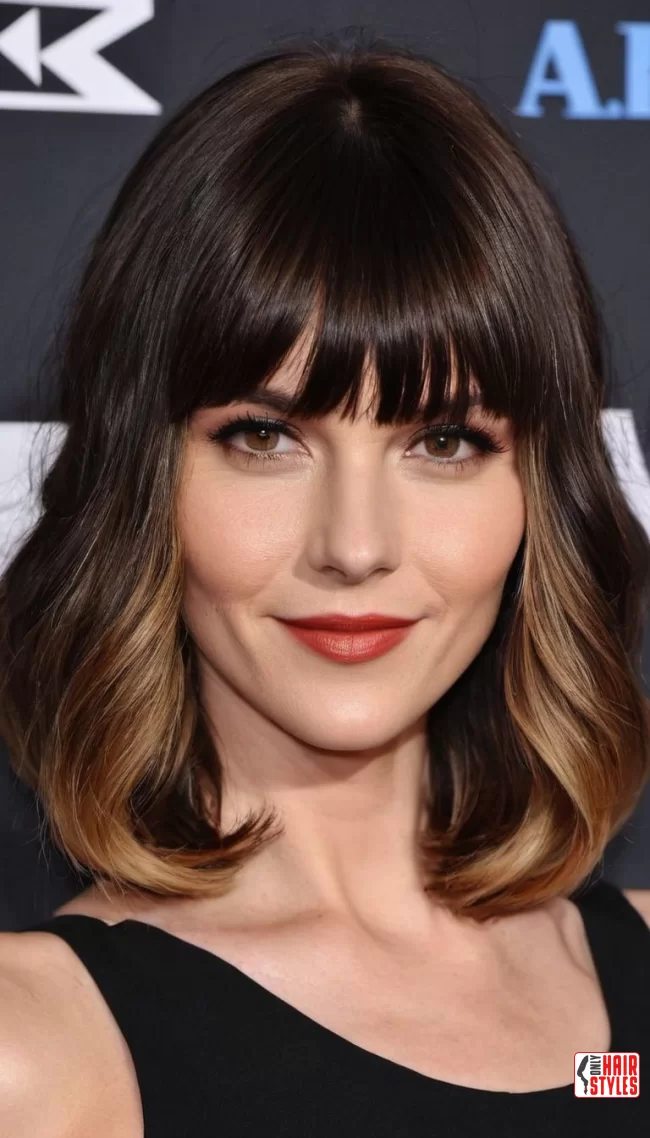 Blunt Bangs with Shoulder-Length Waves | 30 Low-Maintenance Medium-Length Hairstyles With Bangs